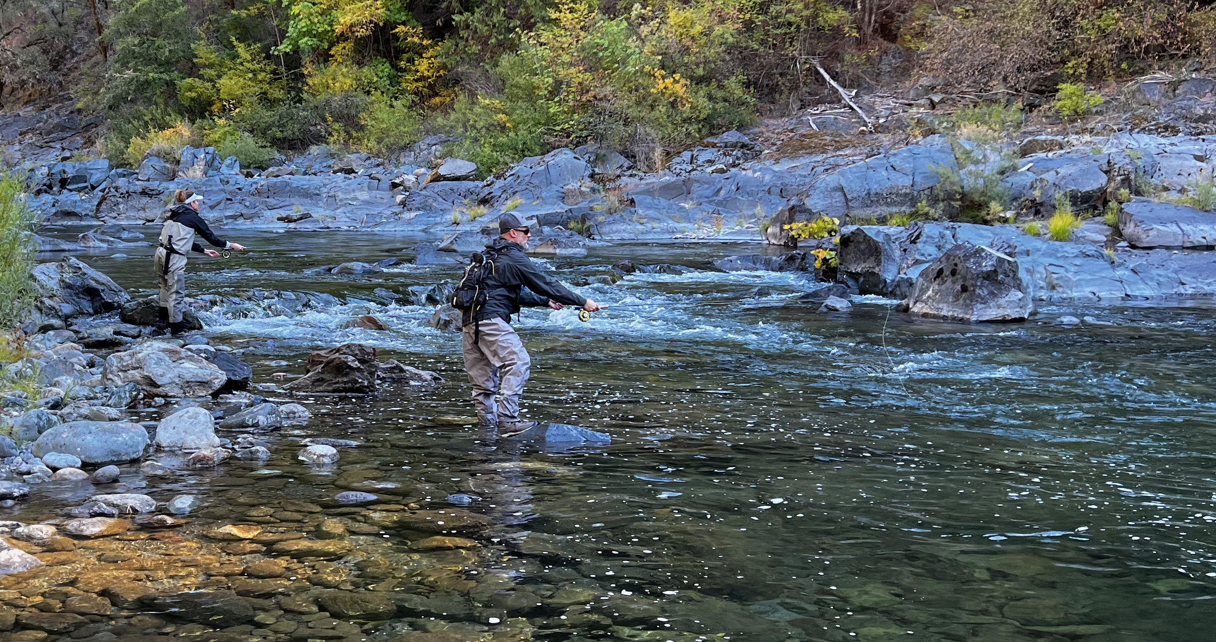 husband and wife fishing North Fork of the Yuba River in Fall